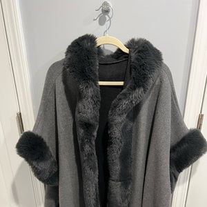 Charcoal gray cape with faux fur trim. One size